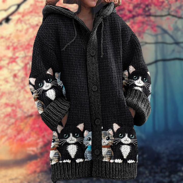 Annelie | Warm women's sweater with buttons and a hood.